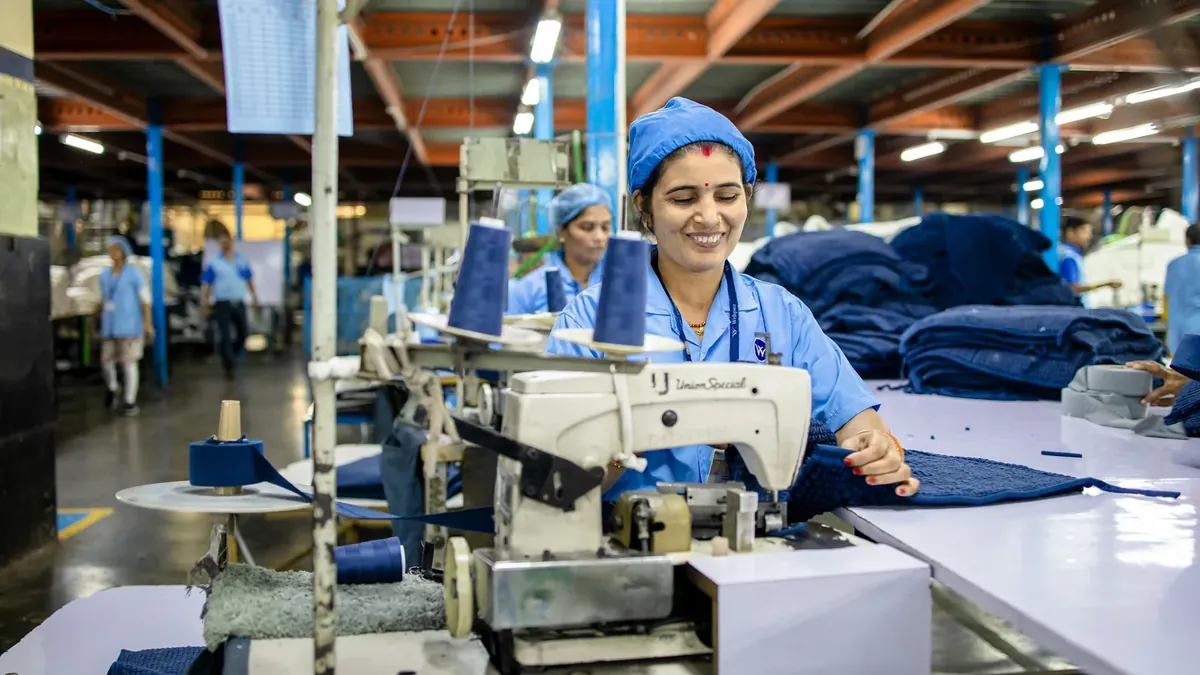 Workers are sewing clothes in a factory