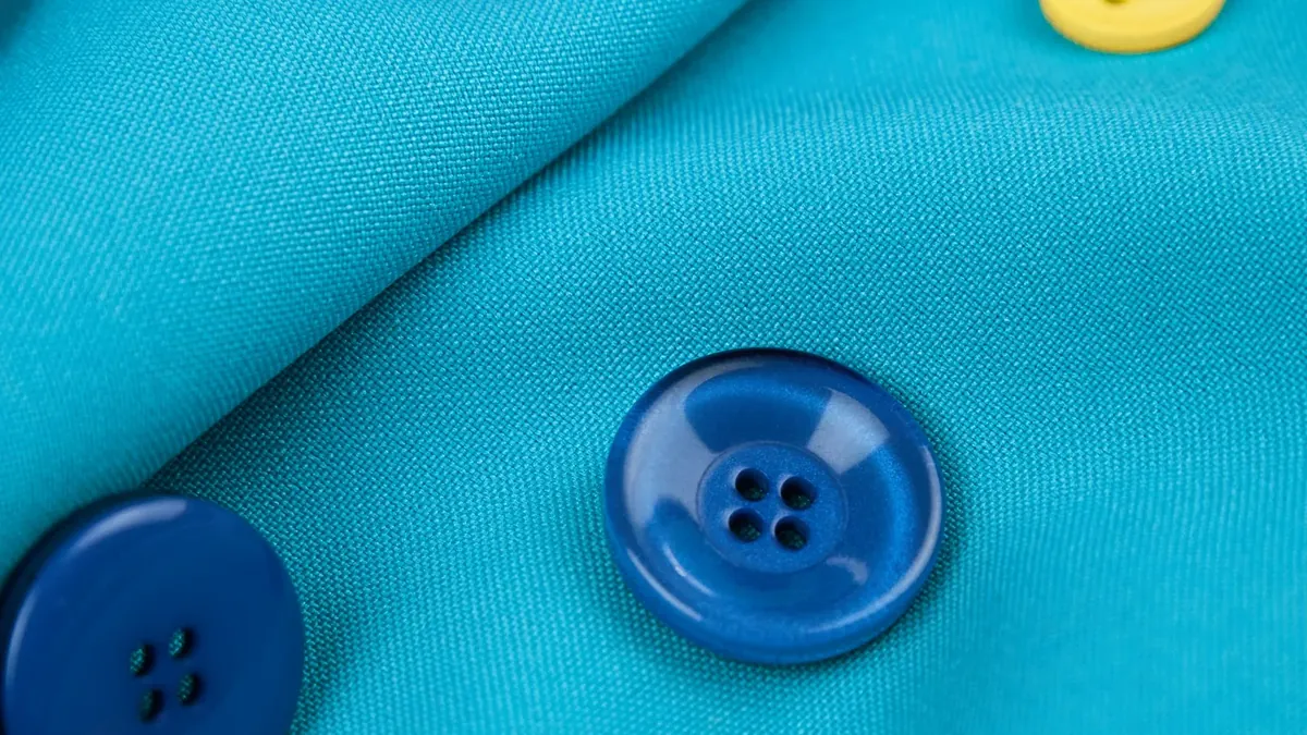 A close up of buttons on a blue cloth