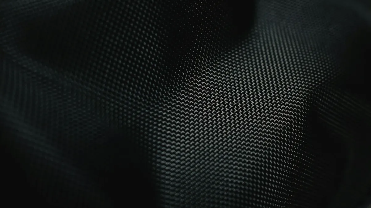 A close up of a black fabric texture