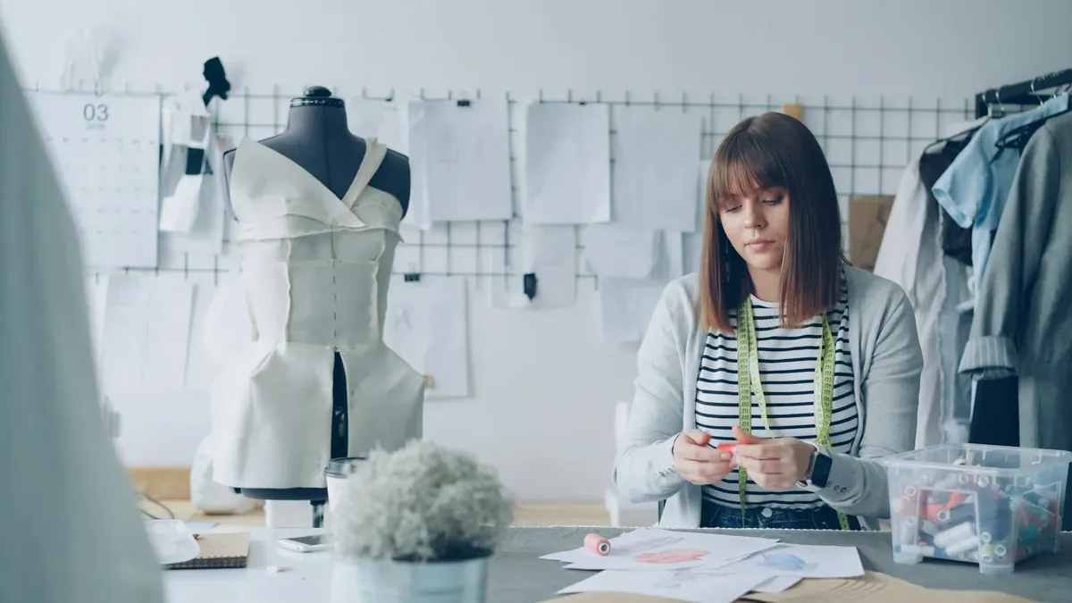 A fashion designer works in her studio