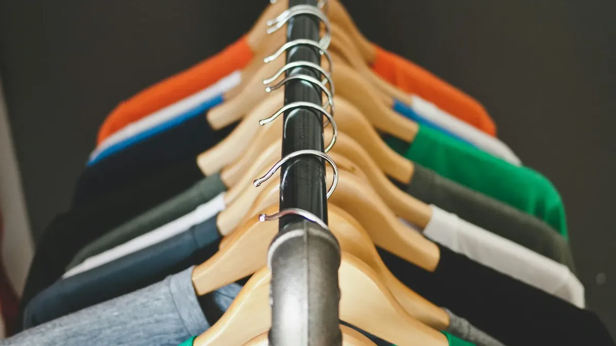 Assorted-color hanged shirts with hangers