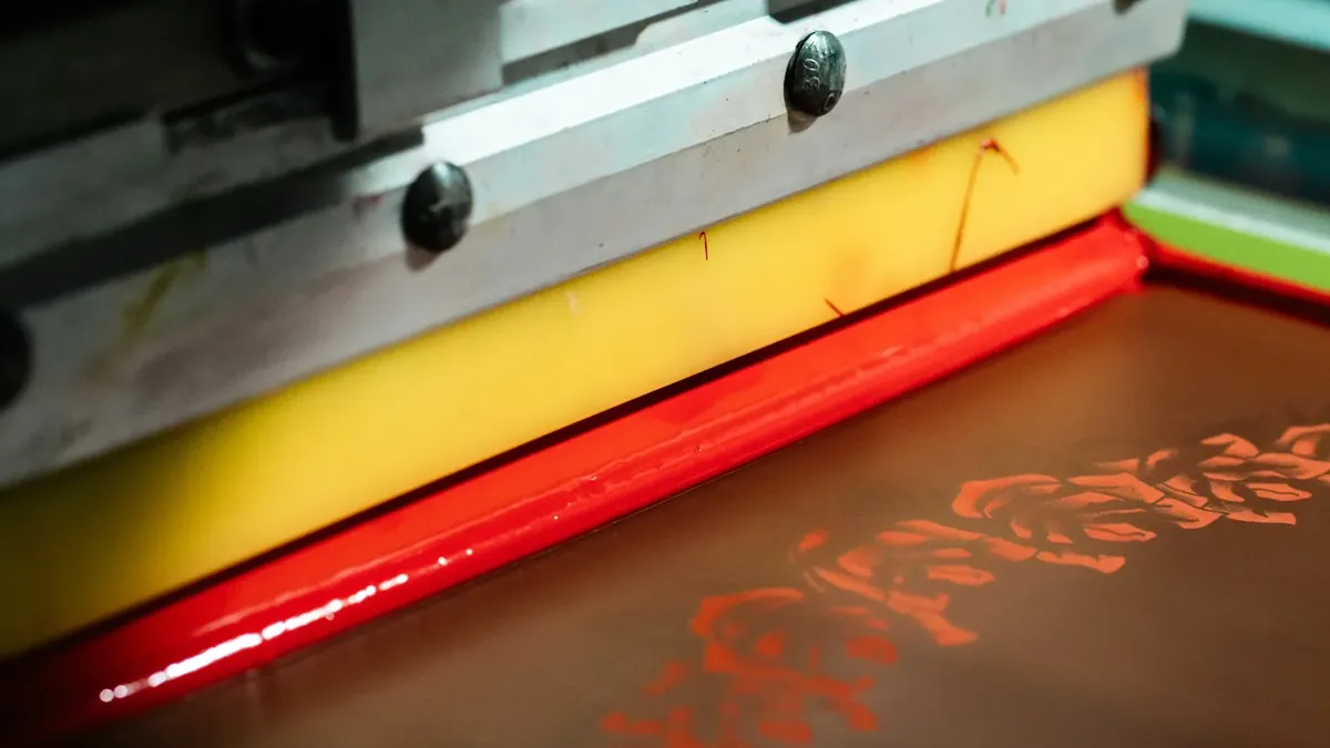 Close-up of screen printing with red ink