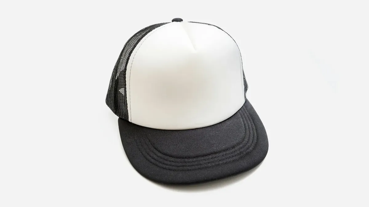 A black and white trucker hat on a white background