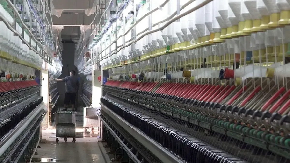 A factory with rows of rows of sewing machines