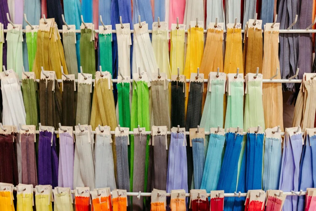 Rows of zipper samples arranged by color.