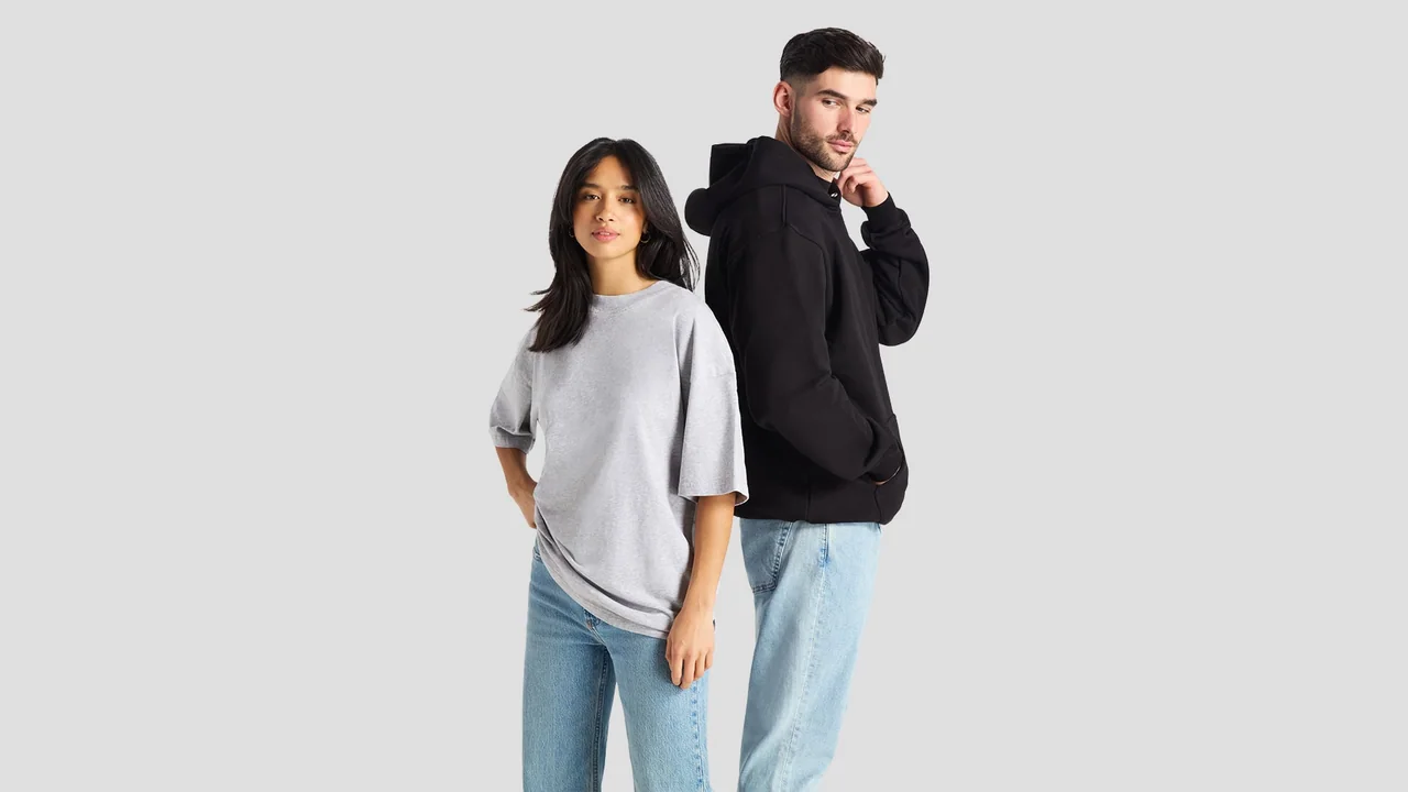 Two models wearing a plain black hoodie and a grey T-shirt.
